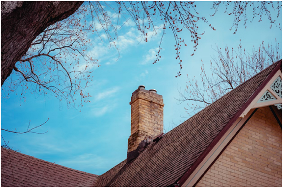 Brick chimney in an old house. 